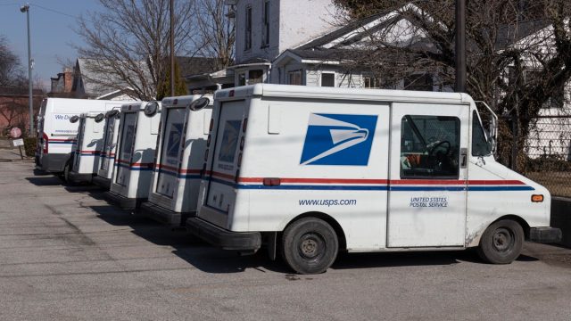 USPS Post Office Mail Trucks. The Post Office is responsible for providing mail delivery.