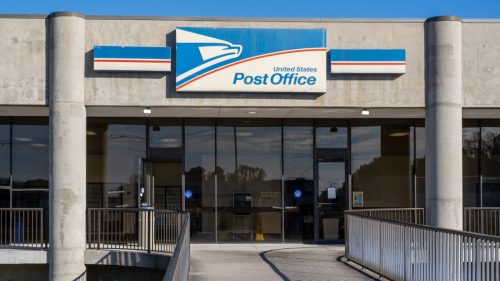 USPS building in a beautiful, blue sky day as background.