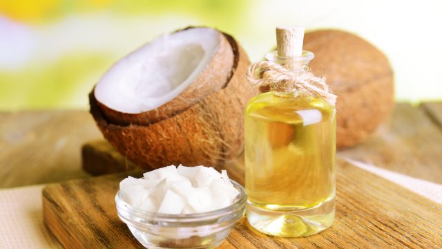 Coconut,Oil,On,Table,On,Light,Background