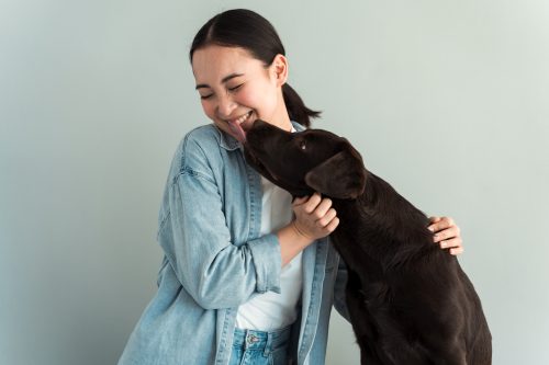 dog licking his owner