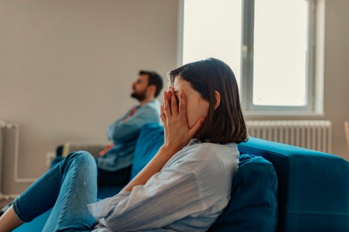 Unhappy Couple After an Argument in the Living Room