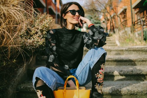 young woman in cropped diy jeans