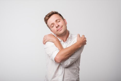 Man Hugging Himself