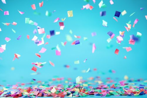 colored confetti with a blue backround