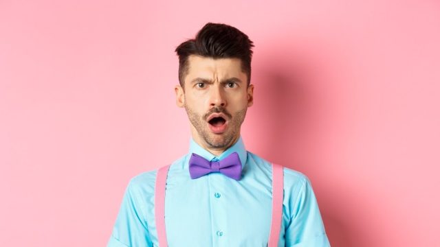 man looking offended after receiving a savage insult