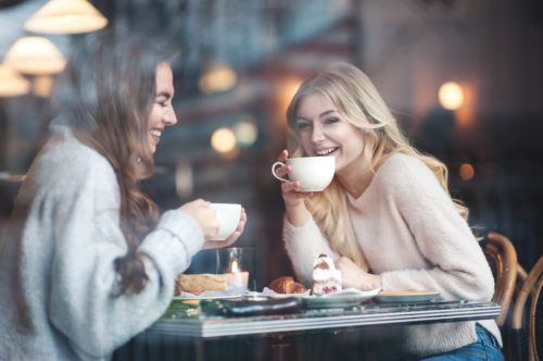 two friends catching up at a cafe