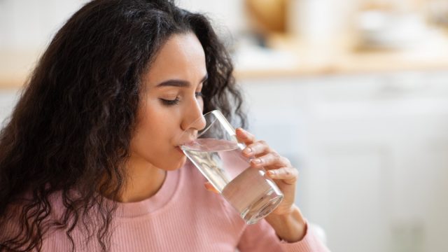 Woman Drinking Water From Glass
