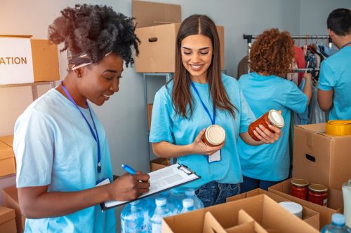two women working at a food drive