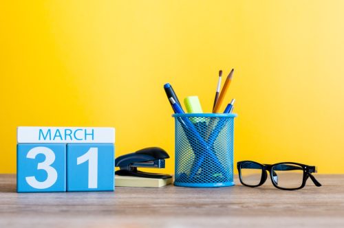 work desk with calendar set to March 31