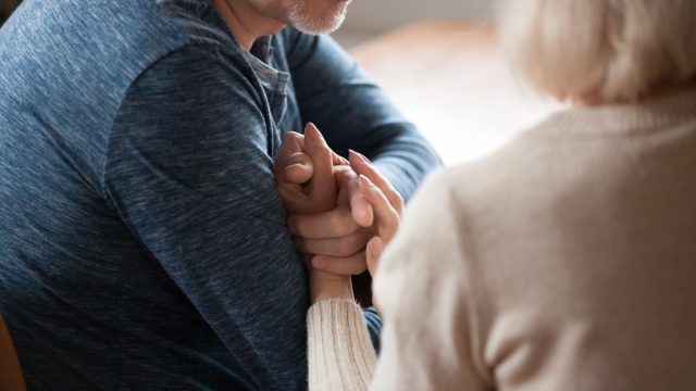 man apologizing to wife