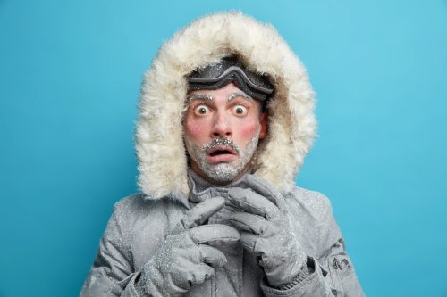 frozen man in winter coat discovering interesting world facts