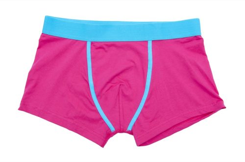 pair of pink boxer-briefs in front of white background