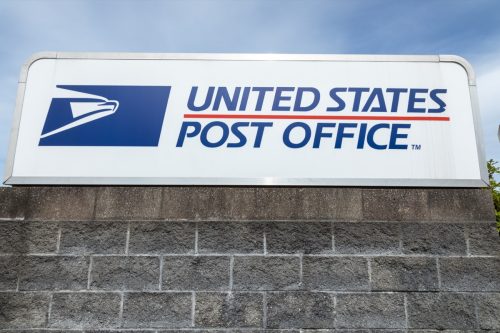 "United States Post Office" sign at the USPS South Hill branch, with space for text on bottom