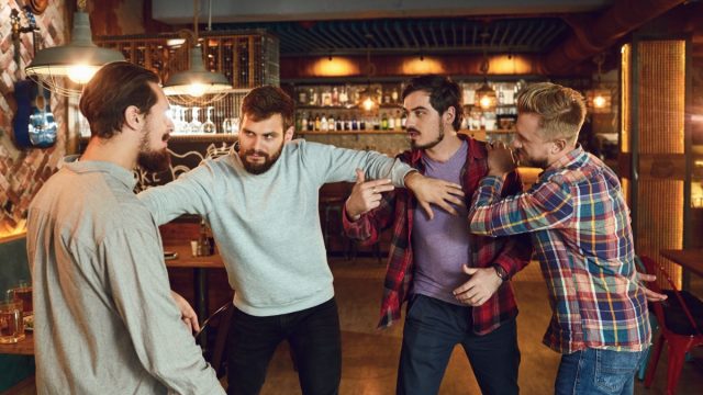 Group of Men Fighting