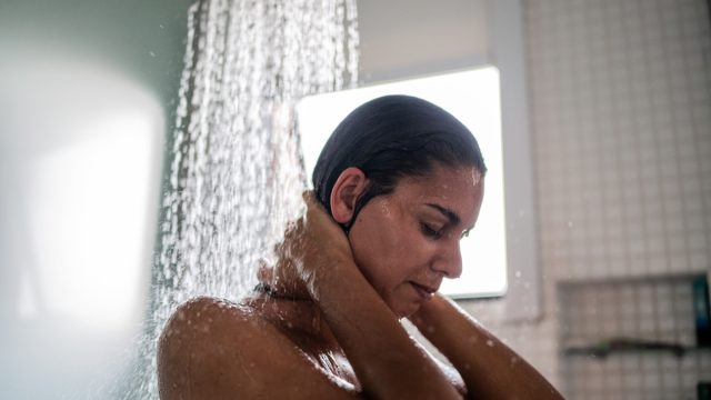 Woman taking a shower at home