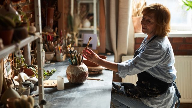 woman in her 60s crafting
