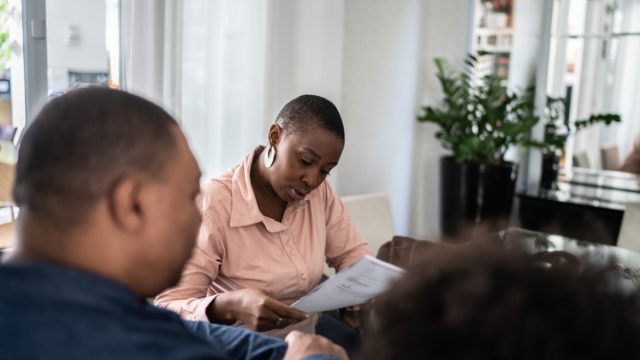 Professional consultant talking to customer during a meeting at home