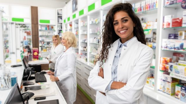Portrait of female pharmacist in drugstore.