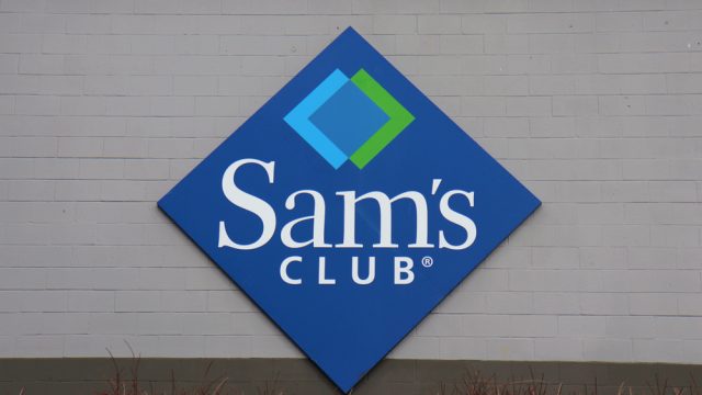 A closeup of a Sam's Club sign on a storefront