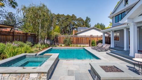 Backyard with pool, hot tub, and fire pit