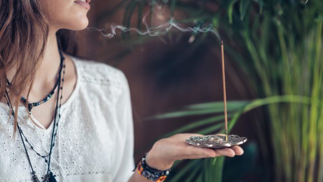 Woman with Incense and Herbs