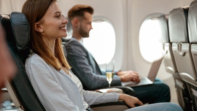 Two passengers on an airplane.