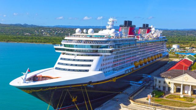 A cruise ship docked at port.