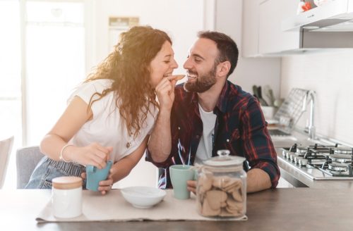 man and woman enjoying breakfast together