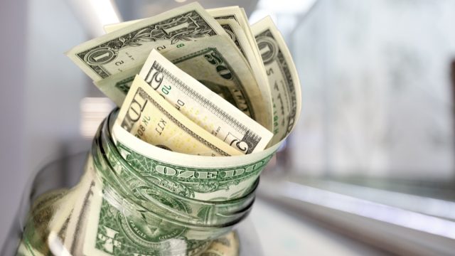 tip jar with cash
