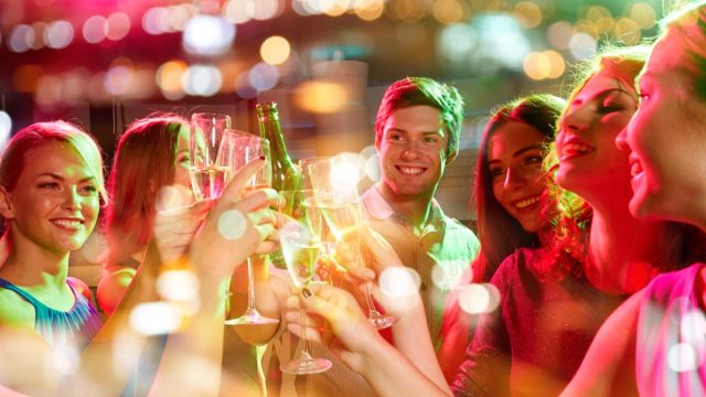 friends smiling and cheersing