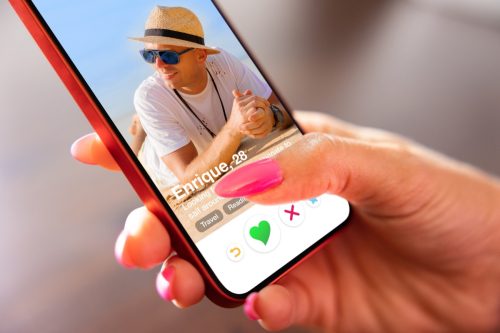 Woman using Tinder on her mobile phone
