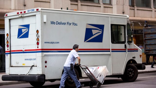 New York City Mailman Delivering Mail