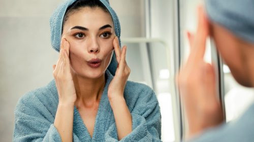 woman doing face yoga