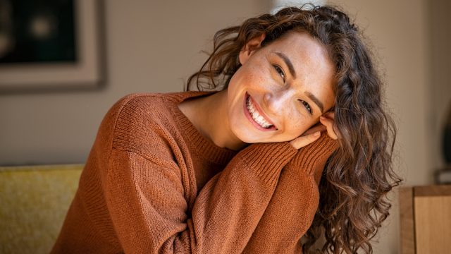 woman in orange sweater