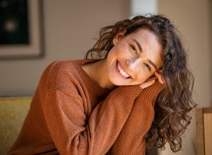 woman in orange sweater