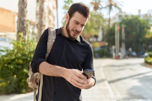 Man Walking and Texting