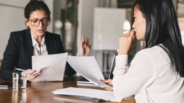 Nervous Young Woman Meeting with Boss