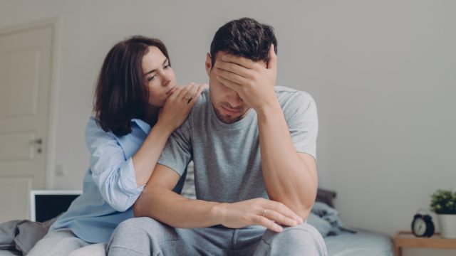 Woman Comforting Unhappy Man