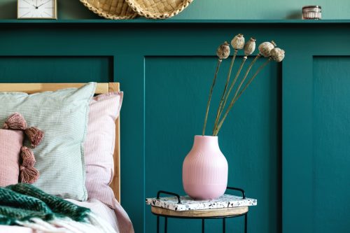 green wall panelling in a modern bedroom