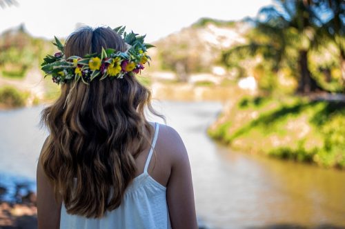 woman wearing a haku lei in her hair