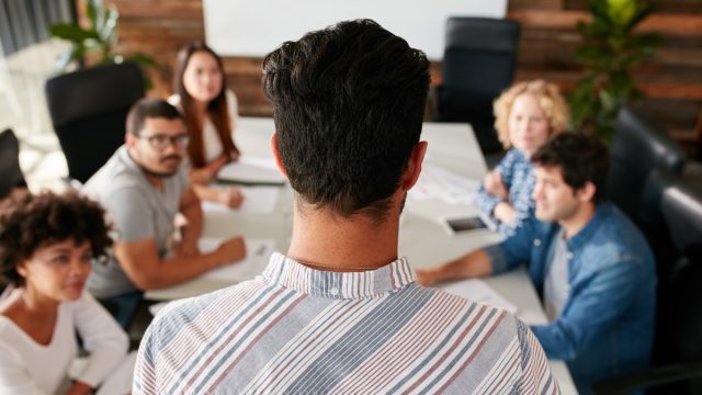 man running a work meeting where they must include a few 'fun facts about me'