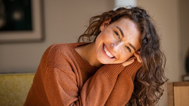 woman smiling at the camera looking attractive