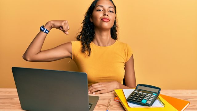 powerful woman flexing muscle