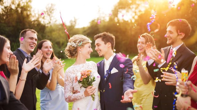 bride and groom with wedding guests