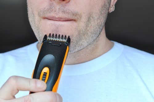man shaving beard