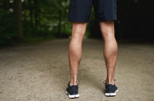 man with toned calves and a wide stance