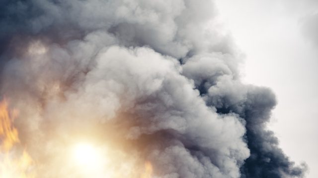 Grey clouds of smoke in the sky.
