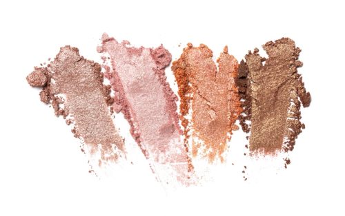 four light neutral eyeshadows against white background