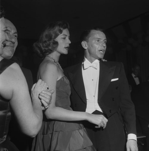 Lauren Bacall and Frank Sinatra at an Oscars after party in 1955