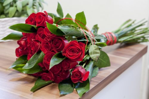 bouquet of red roses on a table